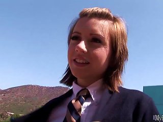 A Girlish Woman, Lexi Belle, Pretends To Be An Immature 18-year-old Girl, Dressed In Traditional School Girl Attire